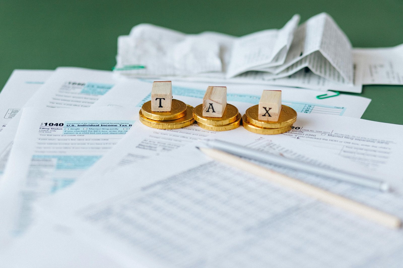 a stack of coins with wooden blocks on top